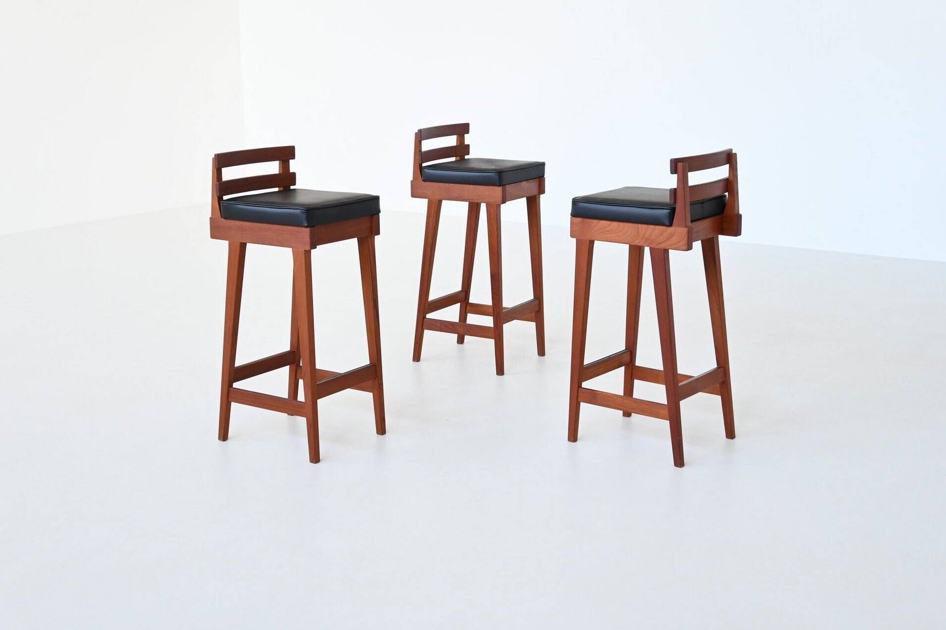 Erik Buck set of three bar stools in teak and leather Dyrlund Denmark 1960