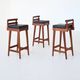 Erik Buck set of three bar stools in teak and leather Dyrlund Denmark 1960