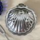 Stainless steel and glass shell butter dish with knife