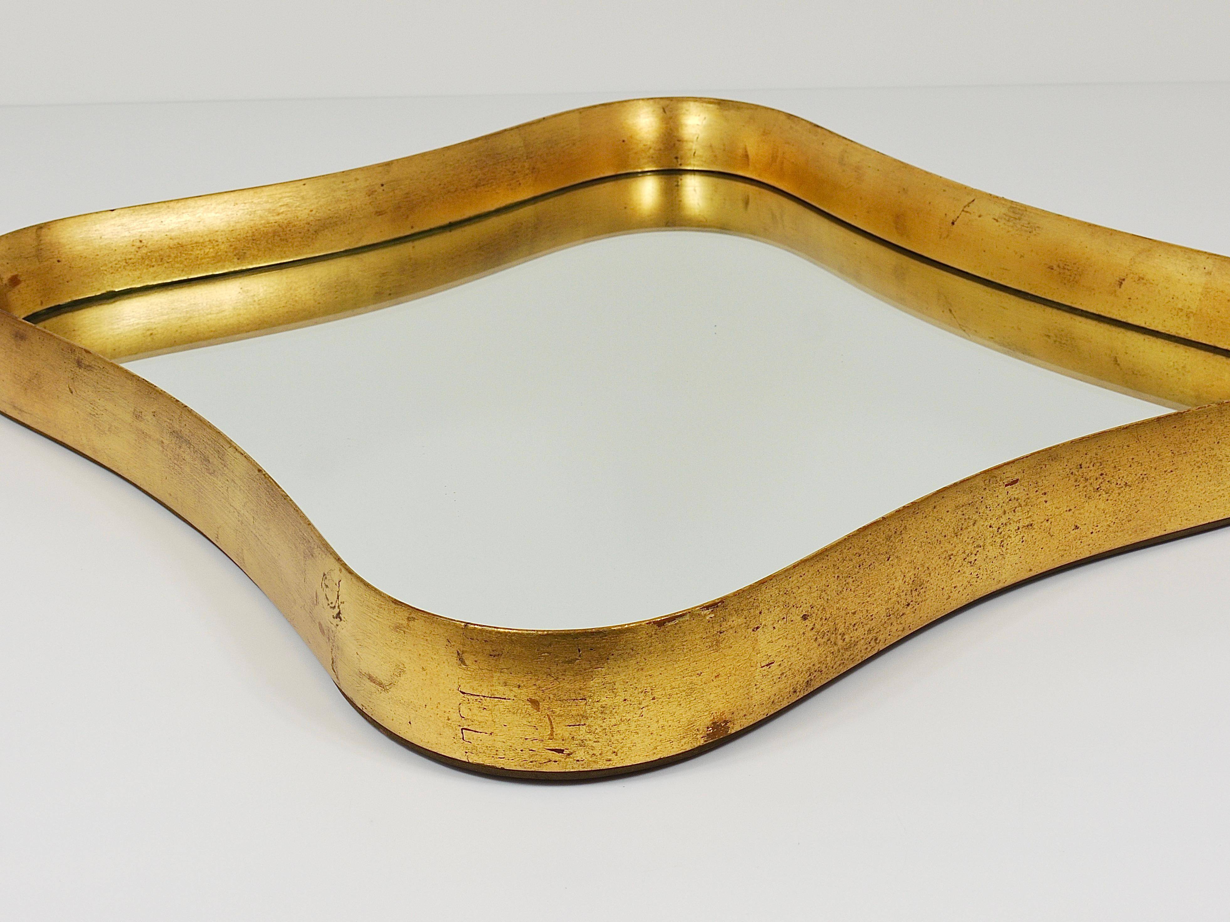 Golden wooden mirror in the style of Gio Ponti by Max Welz, Vienna, Austria, 1940s.