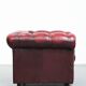 Red English cowhide Chesterfield armchair finished with decorative nails
