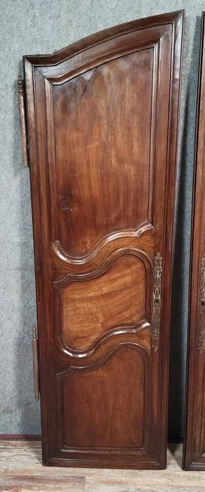 Pair of Louis XV period molded doors in solid walnut