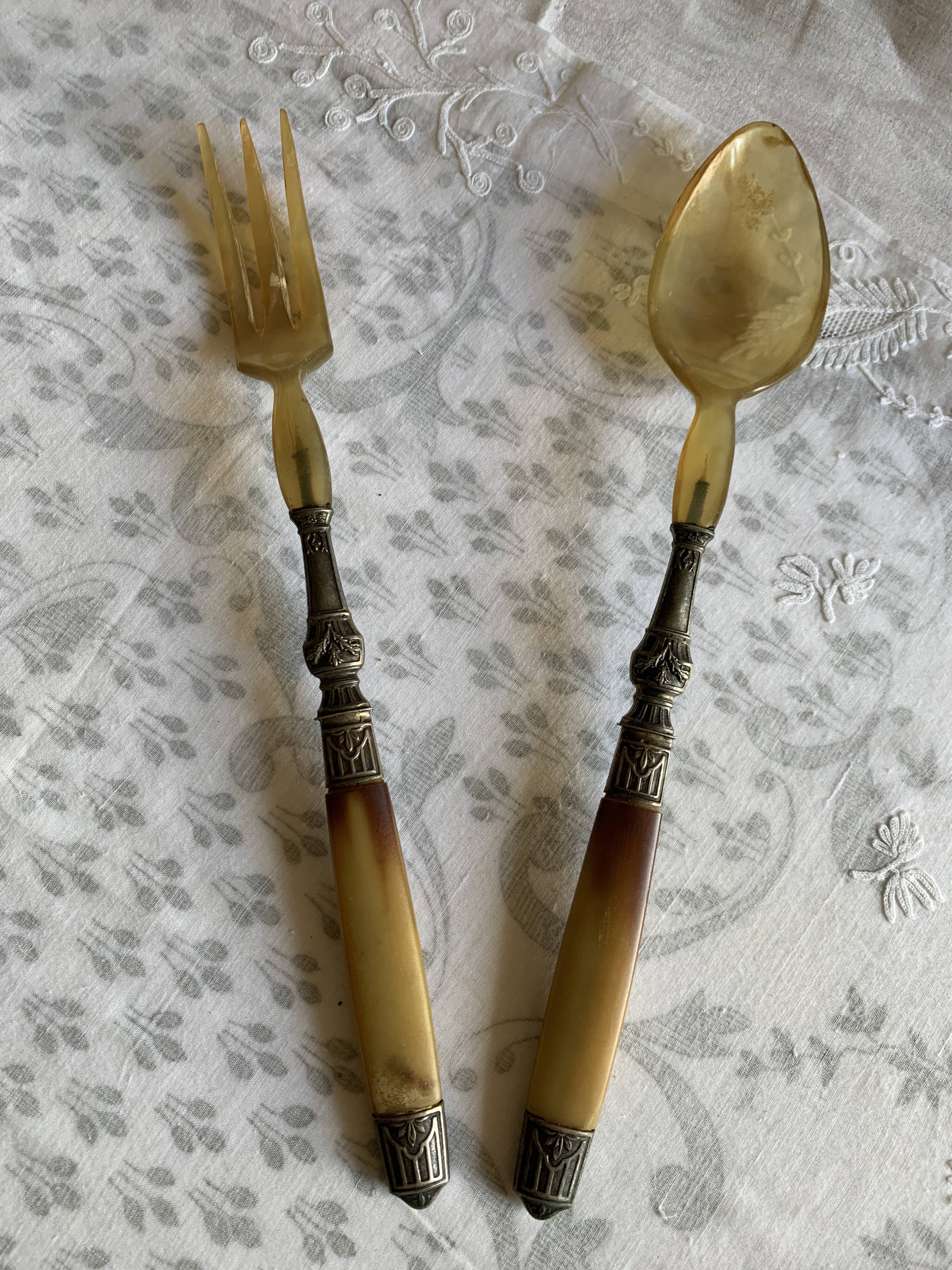 Horn and metal salad servers from the 1920s