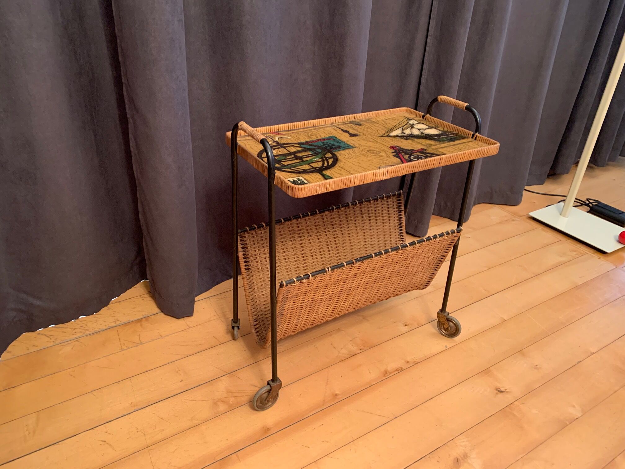 Mobile side table with newspaper holder , Germany , 1960s .