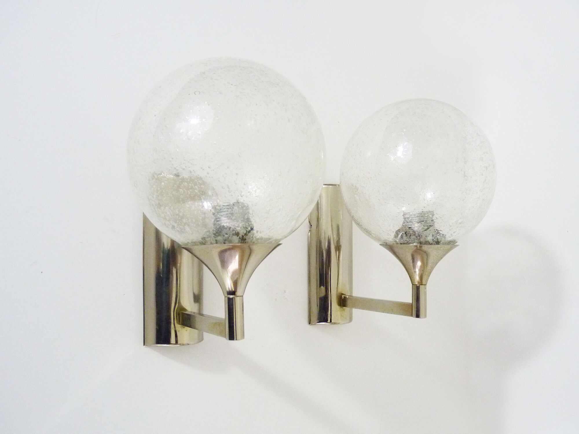 Pair of chrome metal wall sconces and blown glass