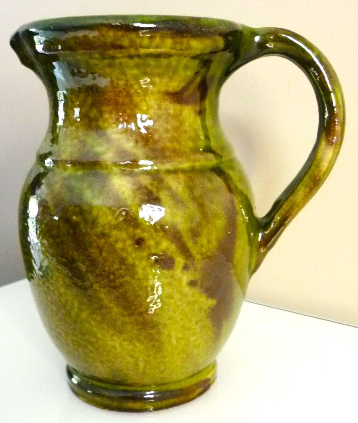 Pitcher vase, thick green glazed terracotta, signature to be identified