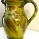 Pitcher vase, thick green glazed terracotta, signature to be identified