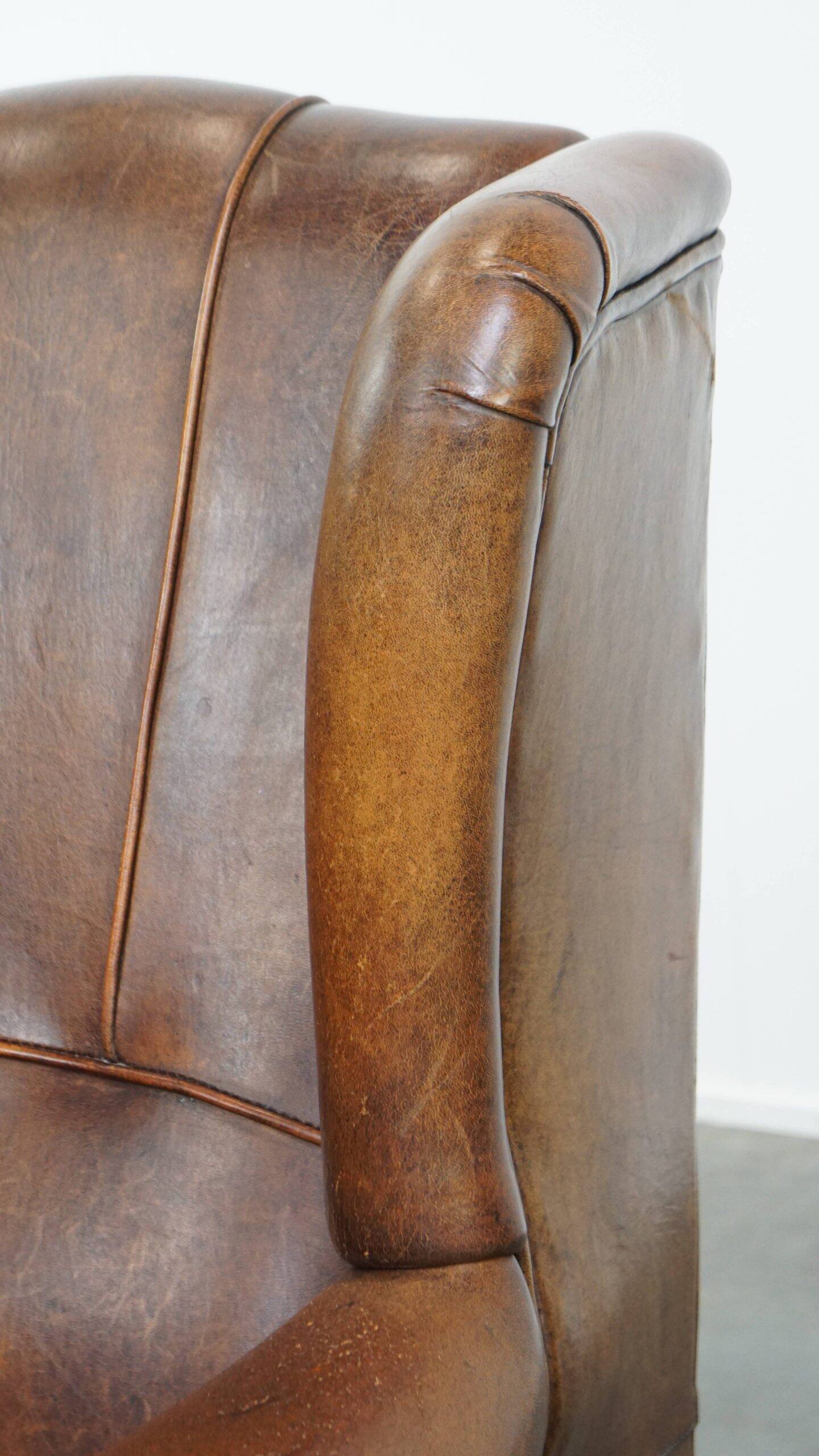 Sheepskin wingback chair in good condition