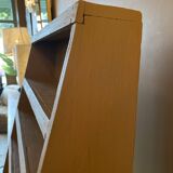 Painted wooden display shelf with an incline