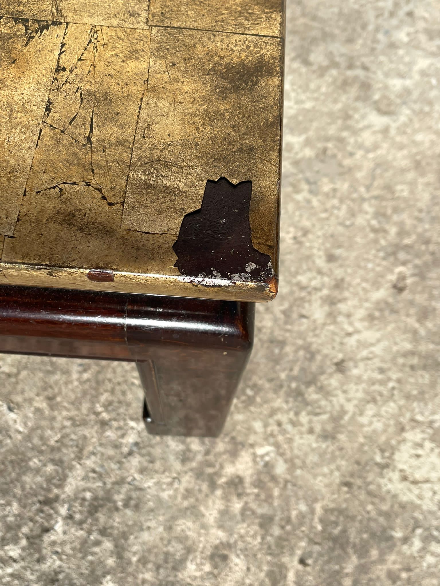 Coffee table covered with gold leaf