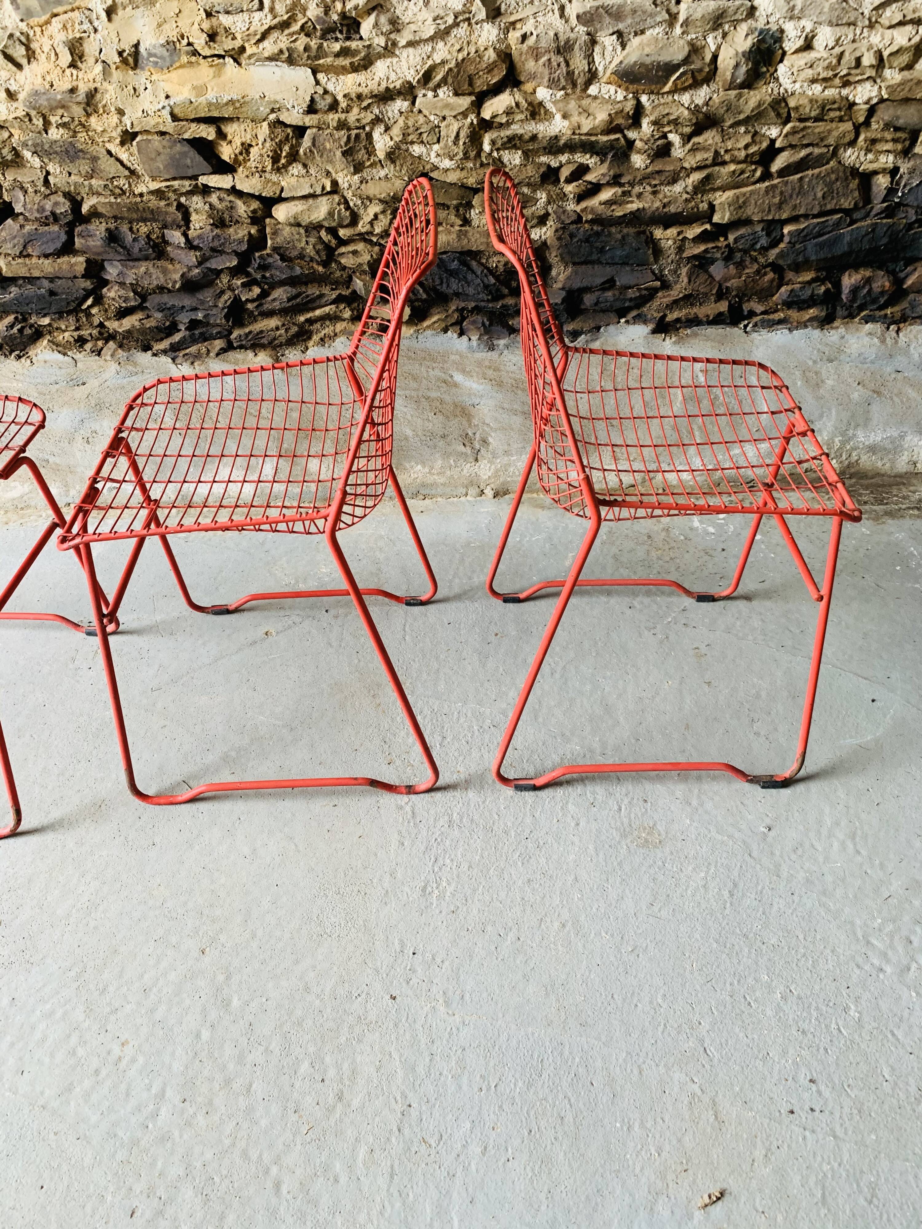 4 red design chairs