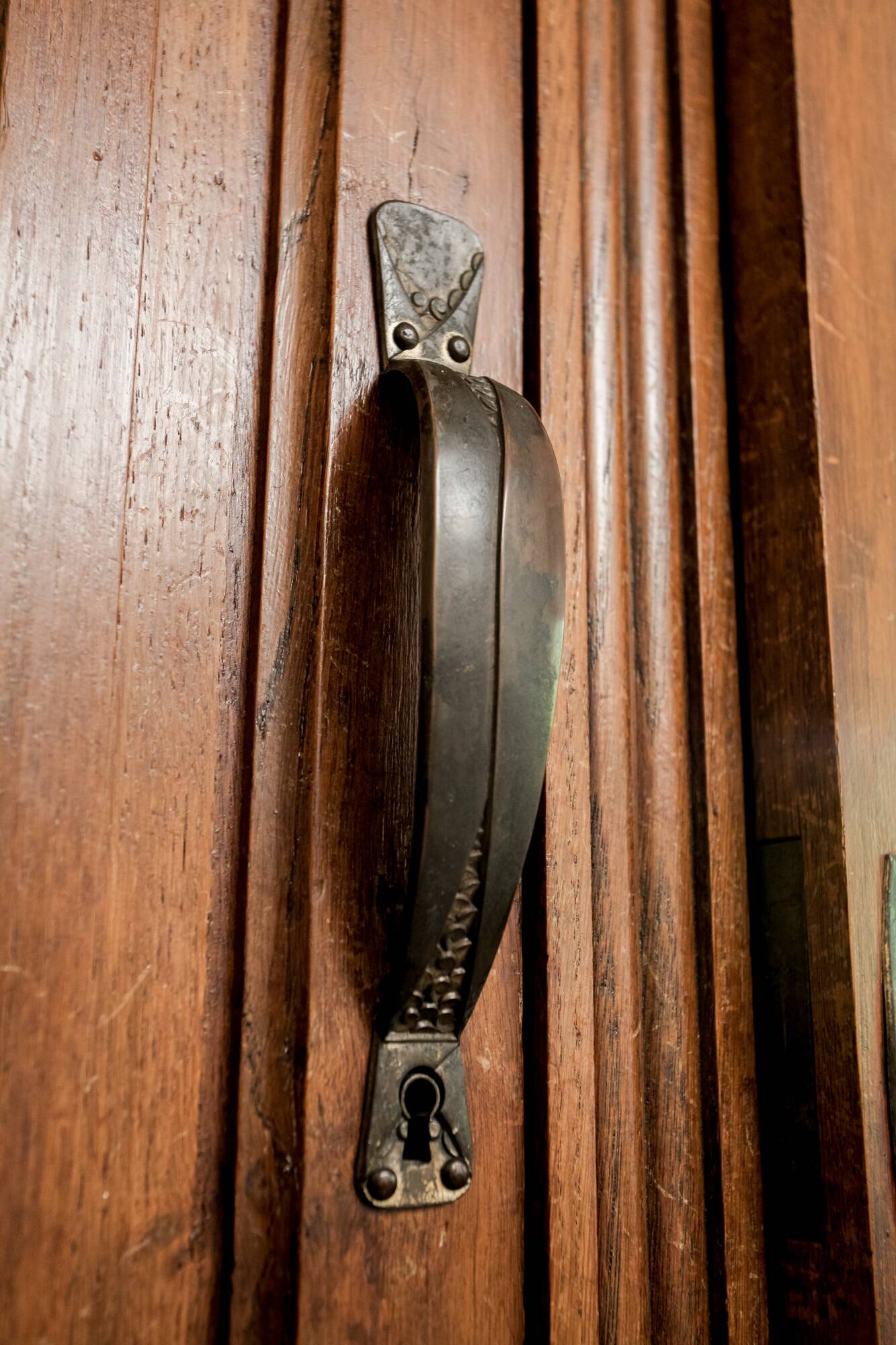 Old solid wood wardrobe with three vintage mirror doors
