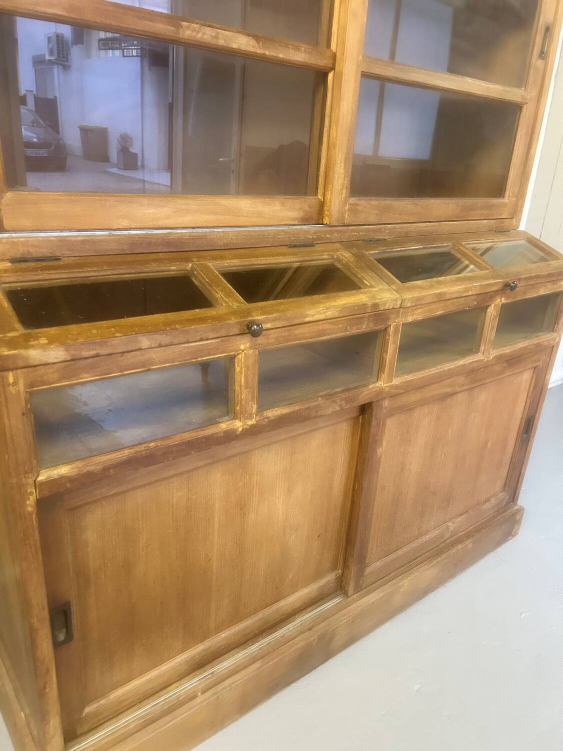 Large antique haberdashery cabinet with glass doors.