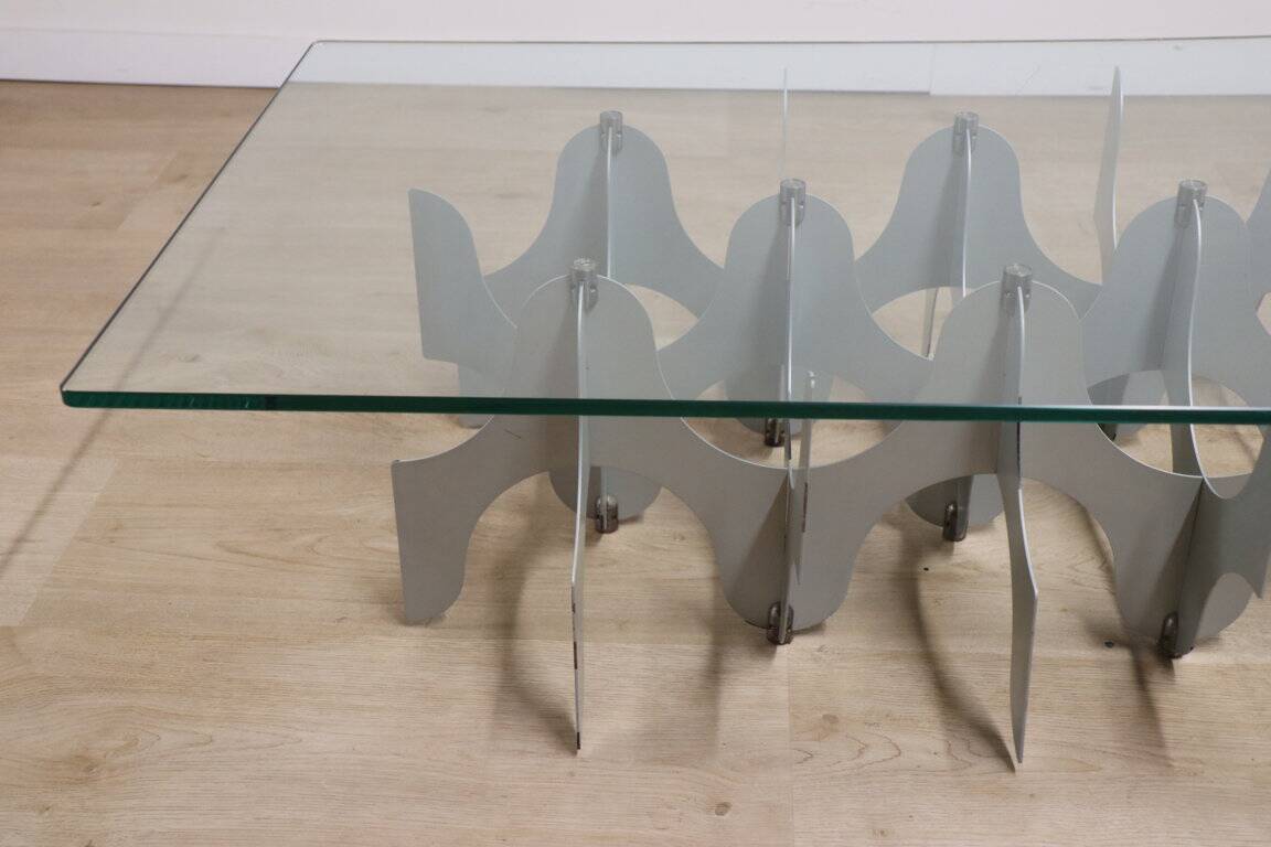 Minimalist sculptural coffee table in metal and glass