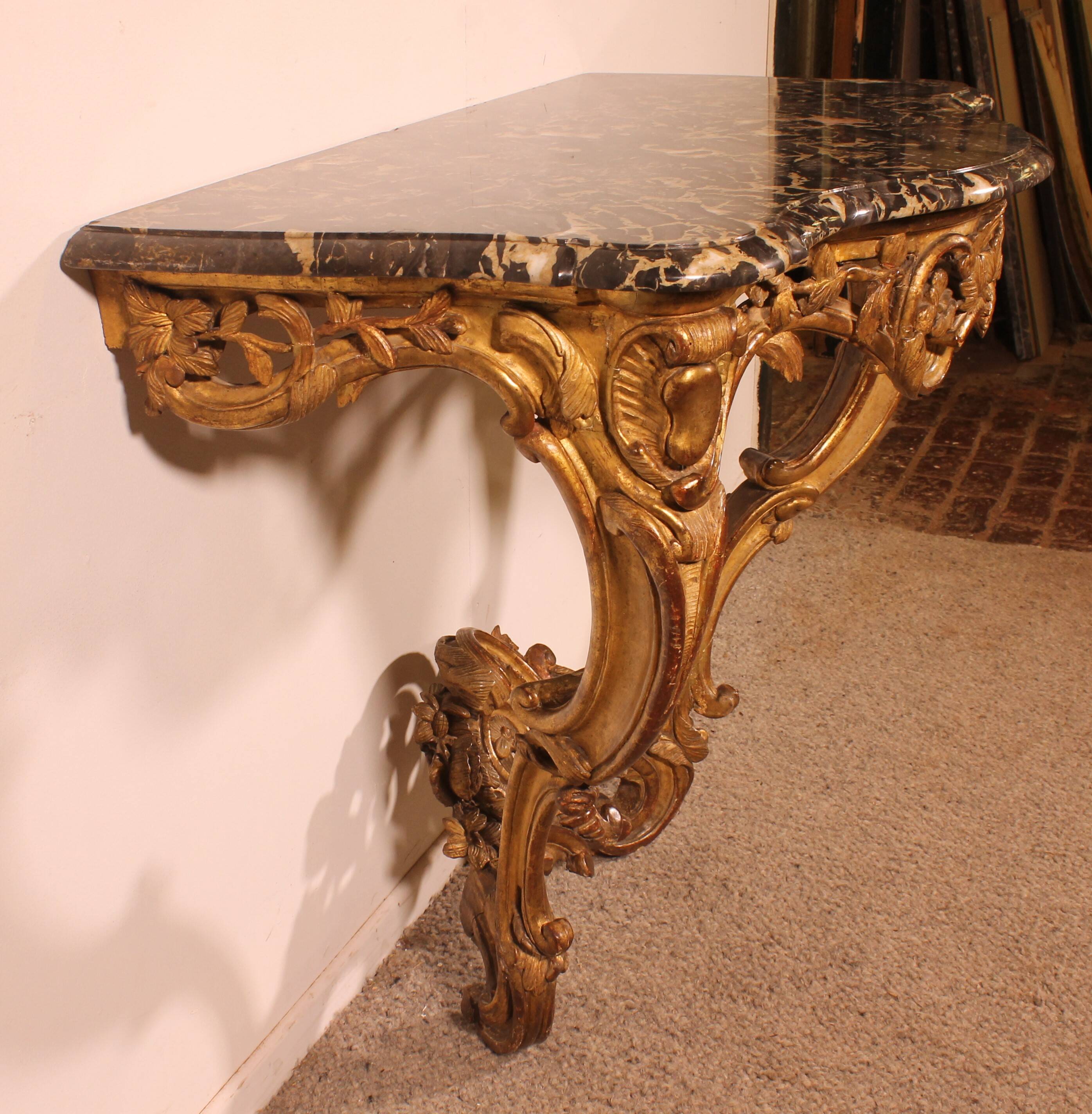 Louis XV period console in gilded wood