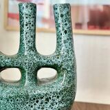 Artisanal vase in black and blue.