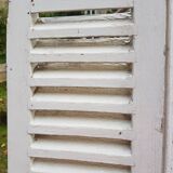 Pair of old shutters with louvers