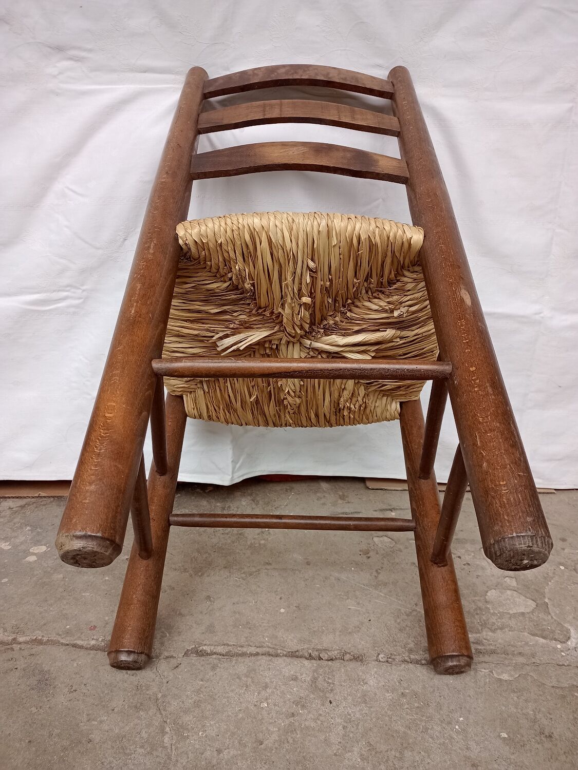 Brutalist chairs in walnut and straw