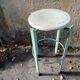 Pair of green factory-style bar stools.