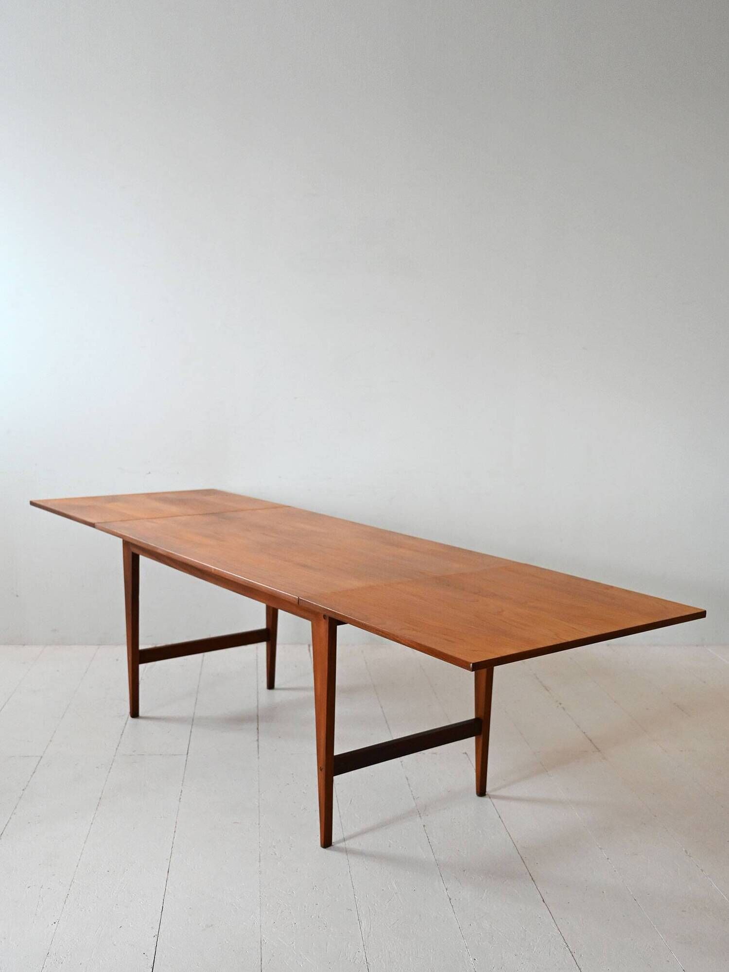 Vintage teak table by ISA Bergamo with drop-leaf extensions