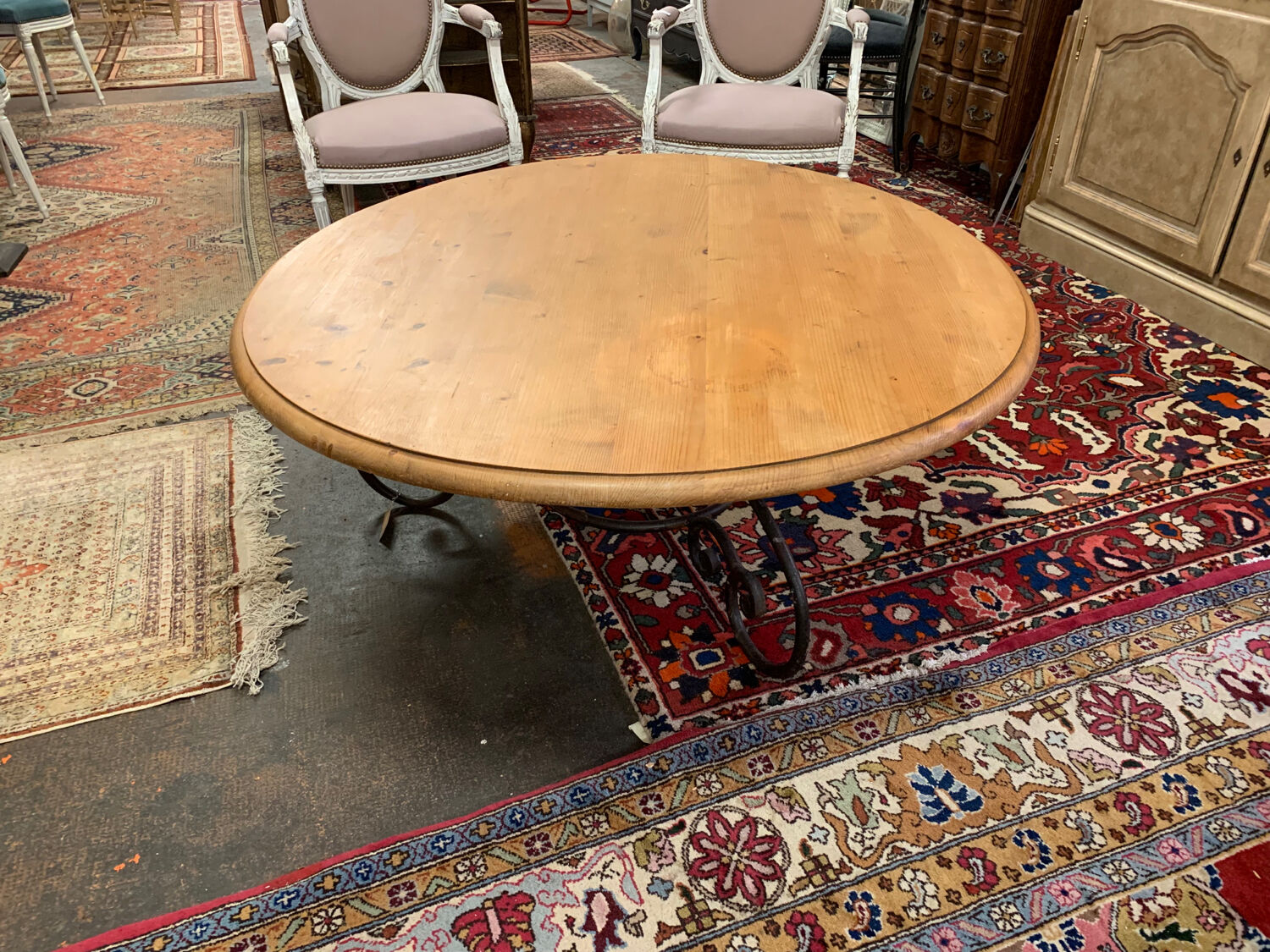 Round wood and wrought iron coffee table