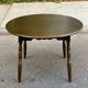 Extendable round table in solid wood with a dark oak satin finish.
