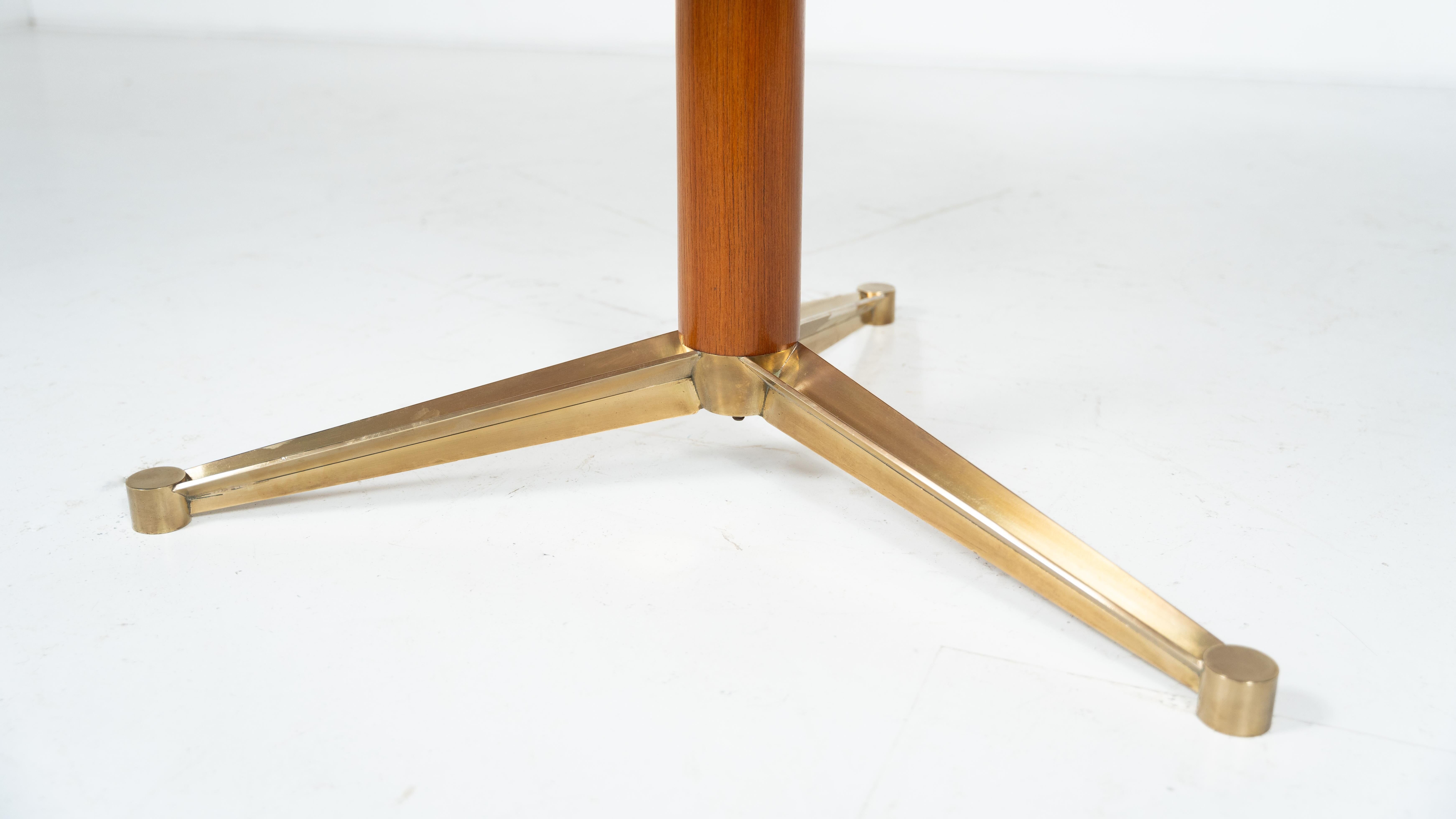 Dining table by Melchiorre Bega, brass and wood, Italy, 1950s.