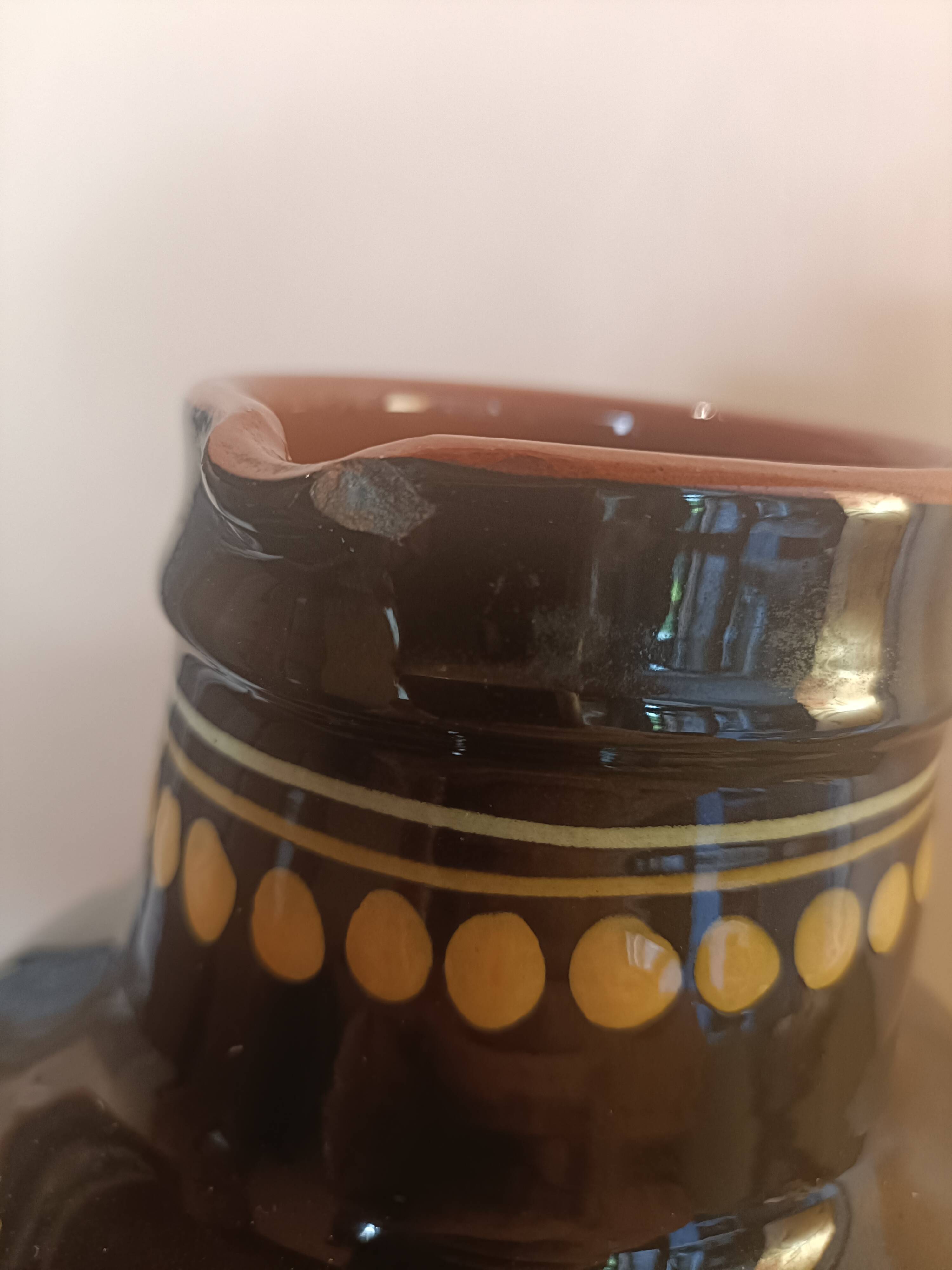 Large glazed terracotta pitcher with floral decoration