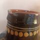 Large glazed terracotta pitcher with floral decoration