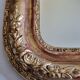 Miroir Louis-Philippe en bois et stuc doré à décor floral, XIXe,  43x38 cm