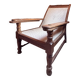 Vintage armchair in solid wood and geometric weaving – lodge spirit