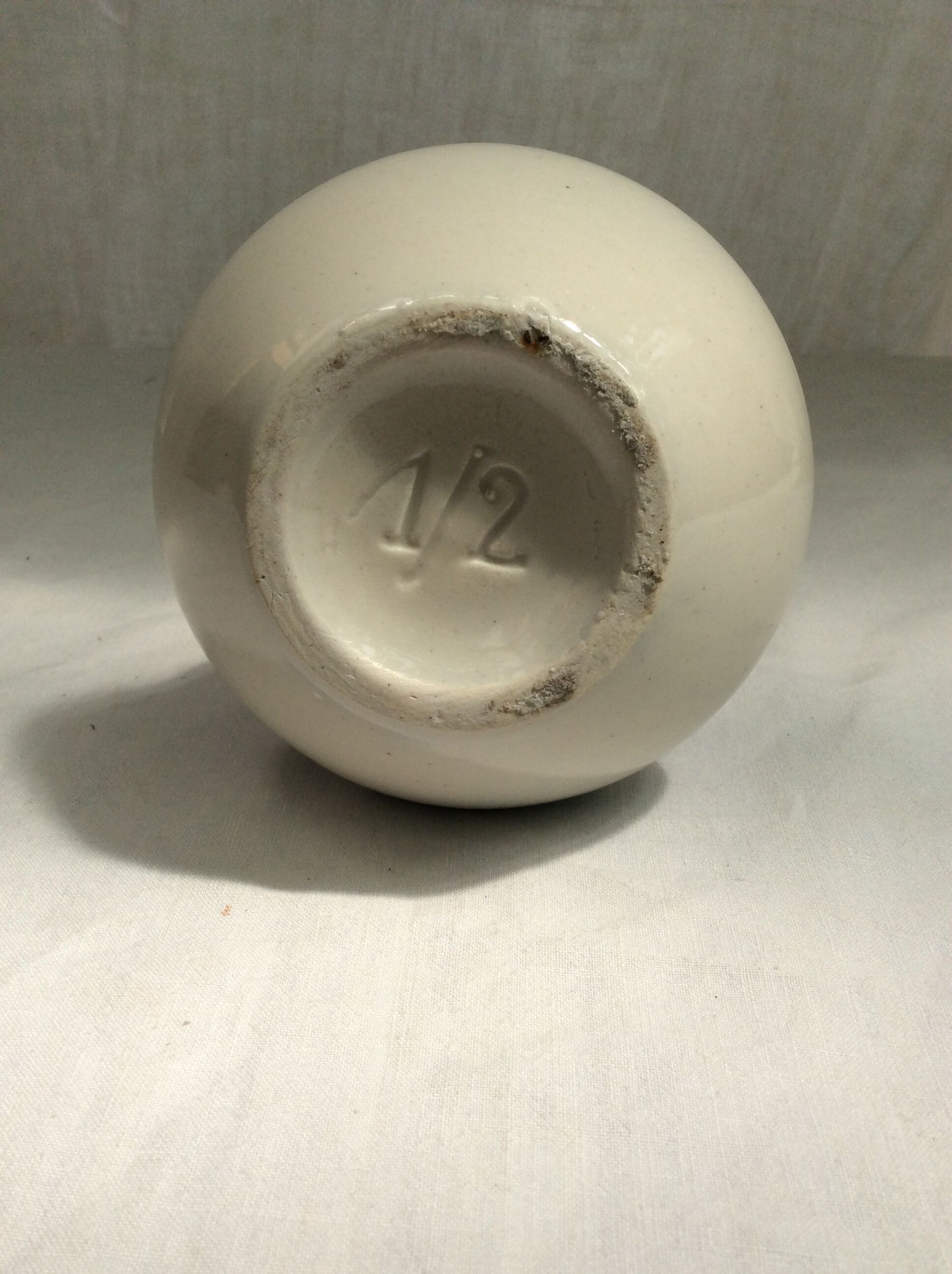 Old pitcher in Dutch-made earthenware signed