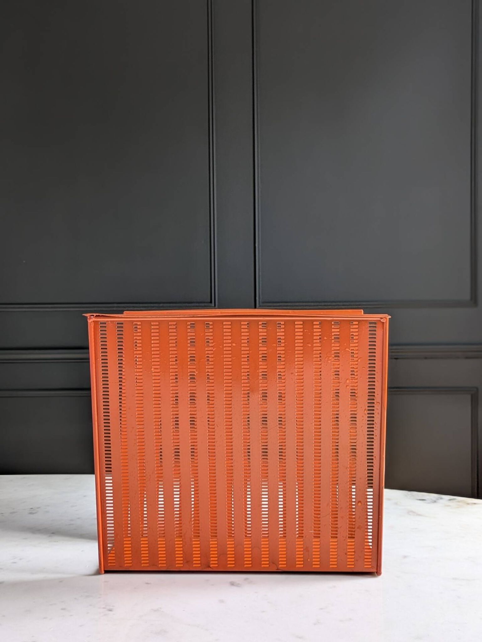 Vintage metal magazine rack in perforated orange/Mathieu Mategot style/70s