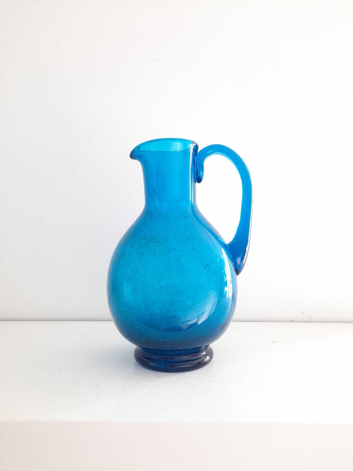 Blue blown glass pitcher