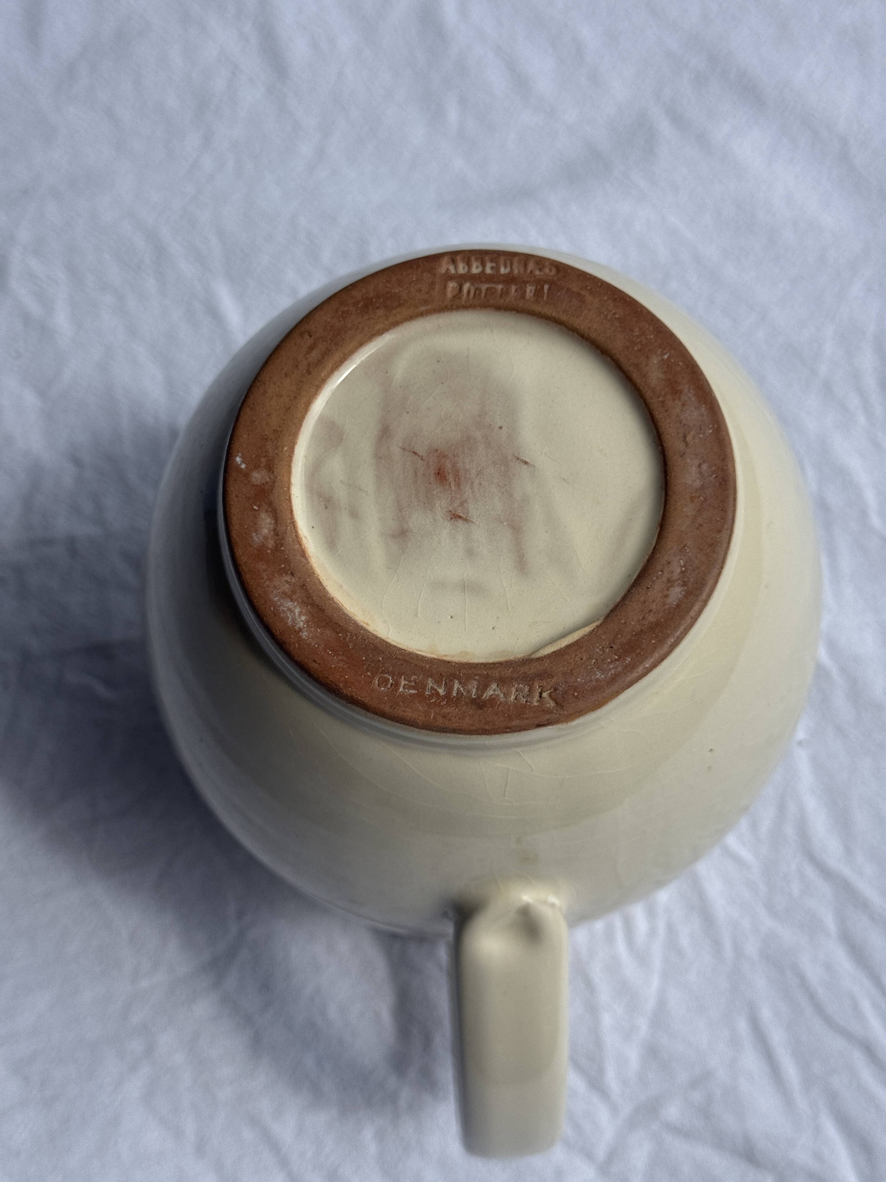 Vintage white pitcher with stylized blue plant frieze H17.5