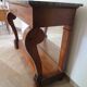 Empire/Restoration style console table with scrolled ends, mirrored back, and claw feet.