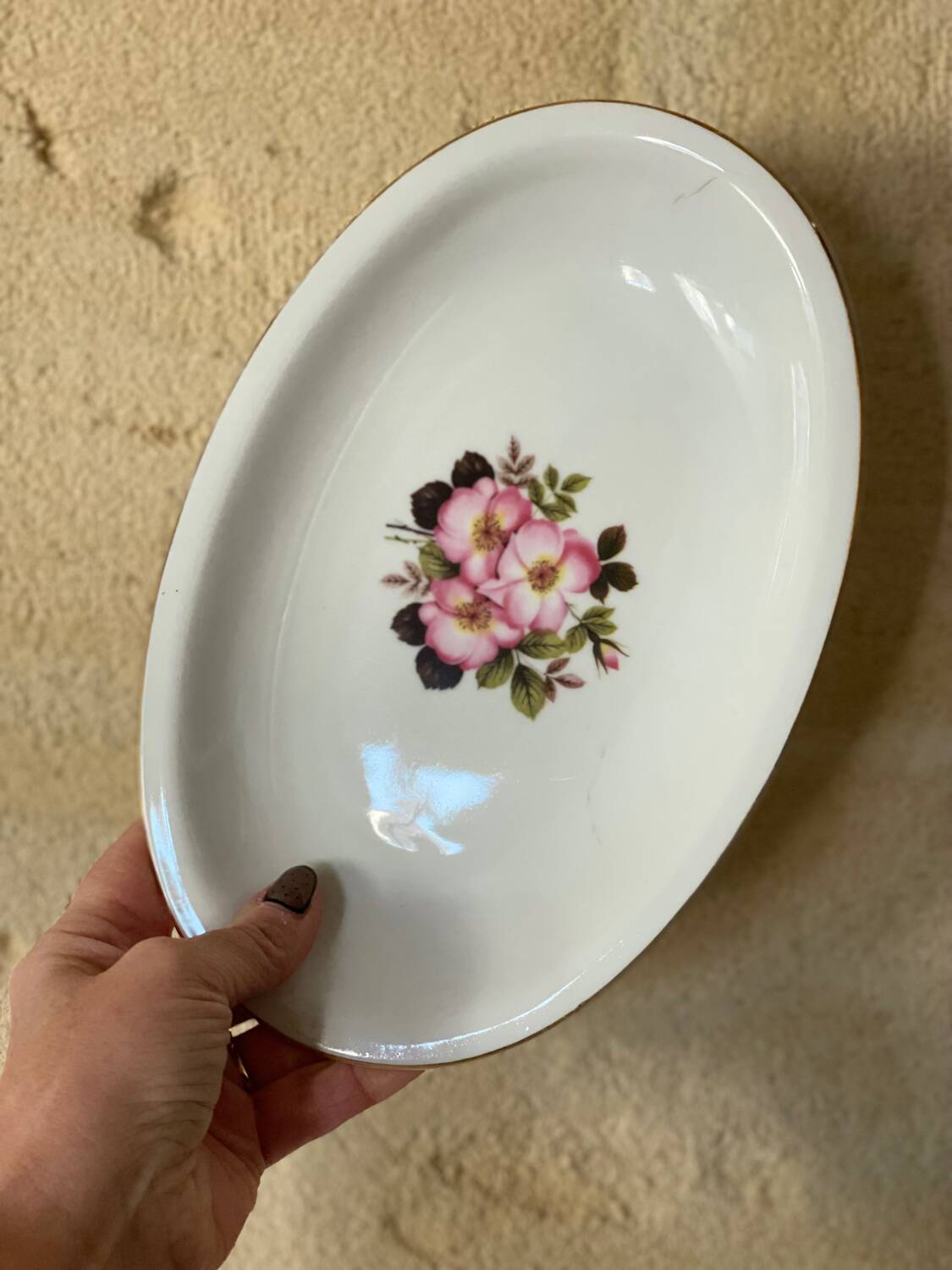 2 oval porcelain dishes with a floral pattern