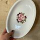 2 oval porcelain dishes with a floral pattern