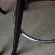 Pair of 1960s bistro bar stools in black and chrome with vinyl shell.