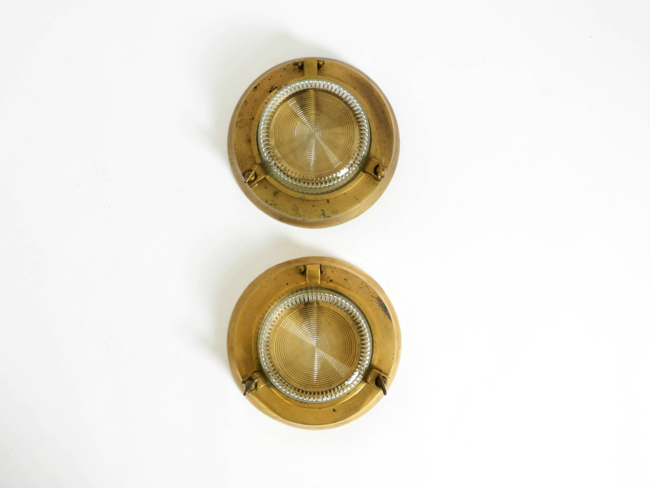 A pair of large, heavy 50s maritime ship wall lamps made of brass and glass