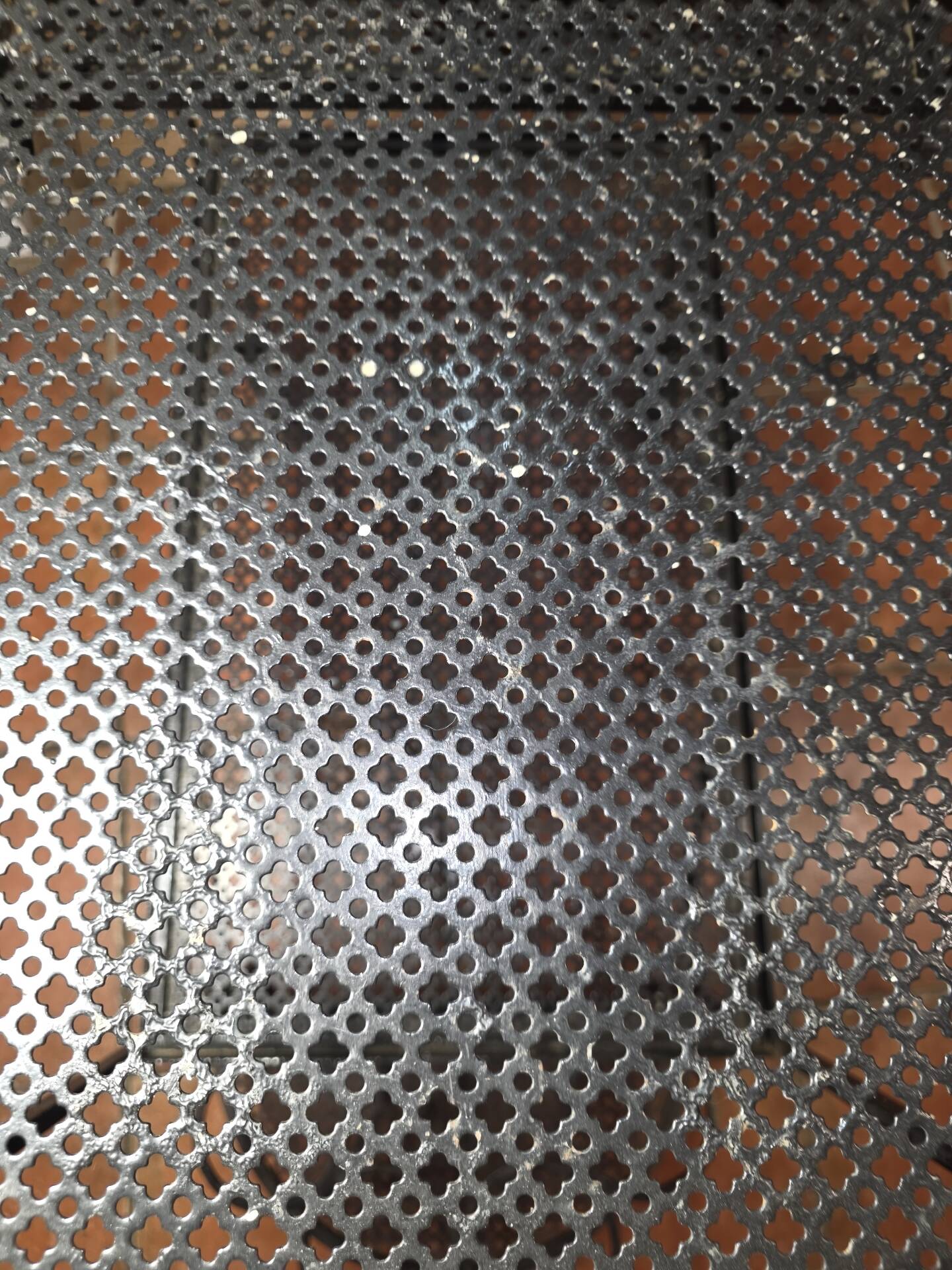 Perforated wrought iron rolling dessert trolley
