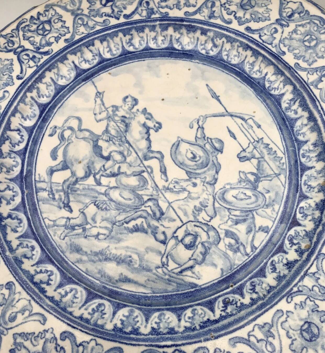 Antique glazed ceramic wall plate with battle scene decoration 41.5 cm