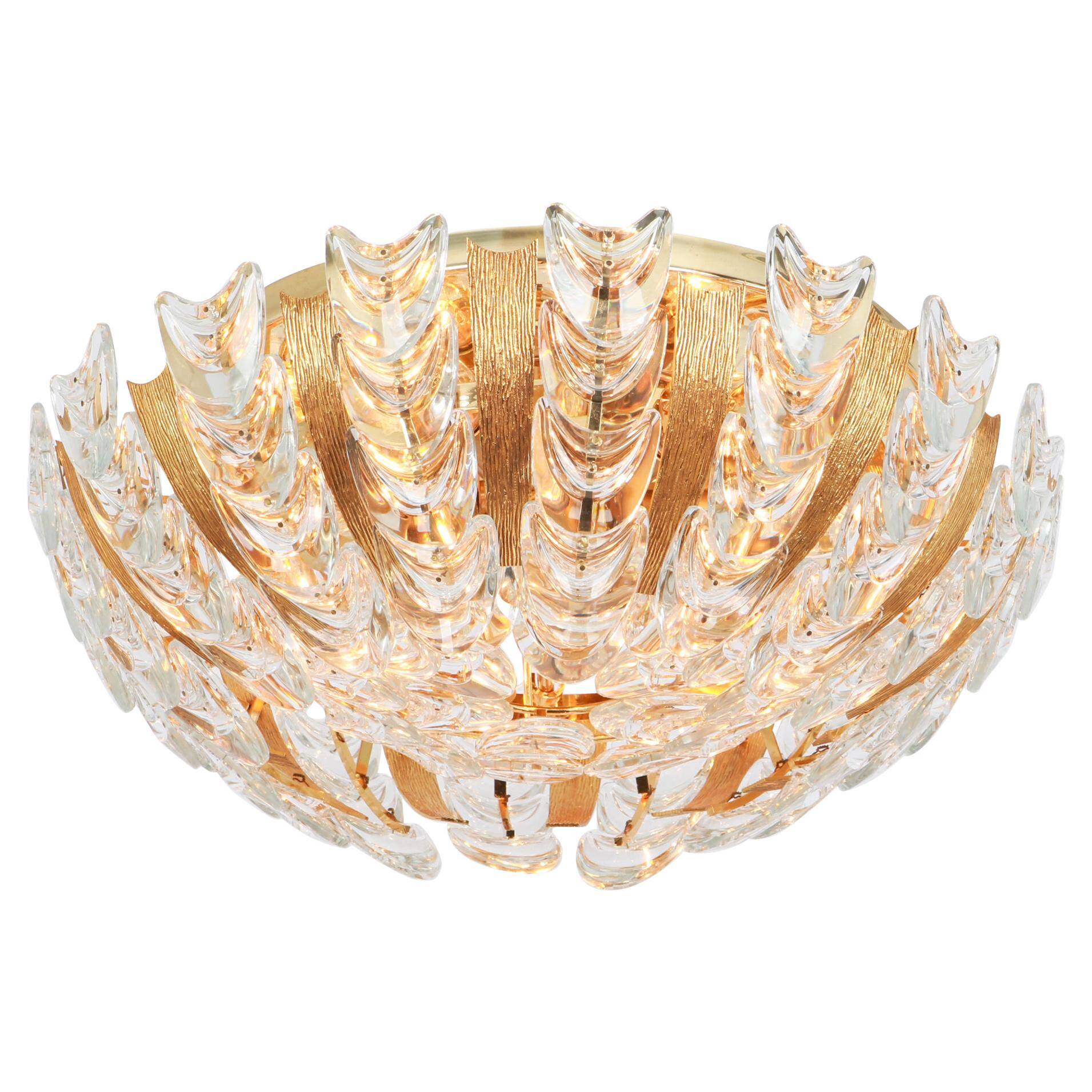 Delicate chandelier in gilded brass and crystal glass in the shape of flowers by Palwa, Germany, 1970s.