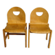Pair of light wood chairs with post-formed seat and backrest.
