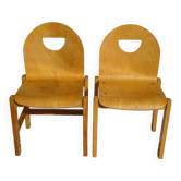 Pair of light wood chairs with post-formed seat and backrest.