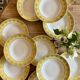 Set of 12 vintage yellow, white and gold soup plates