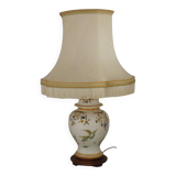 Table lamp with wooden base and fringed shade