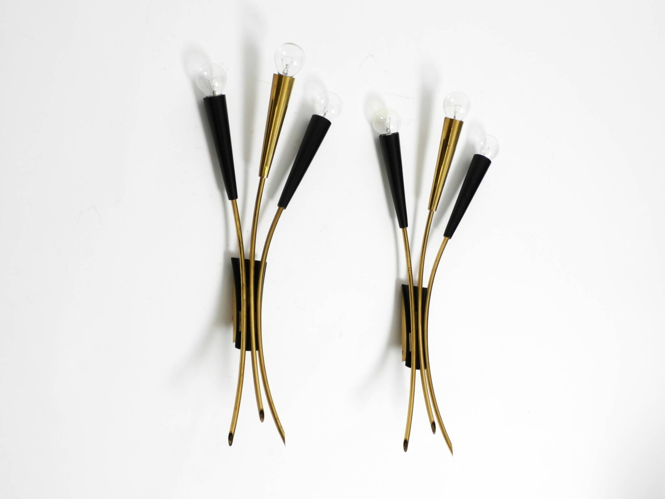 Two beautiful large Mid Century Modern brass 3-light cone wall lamps