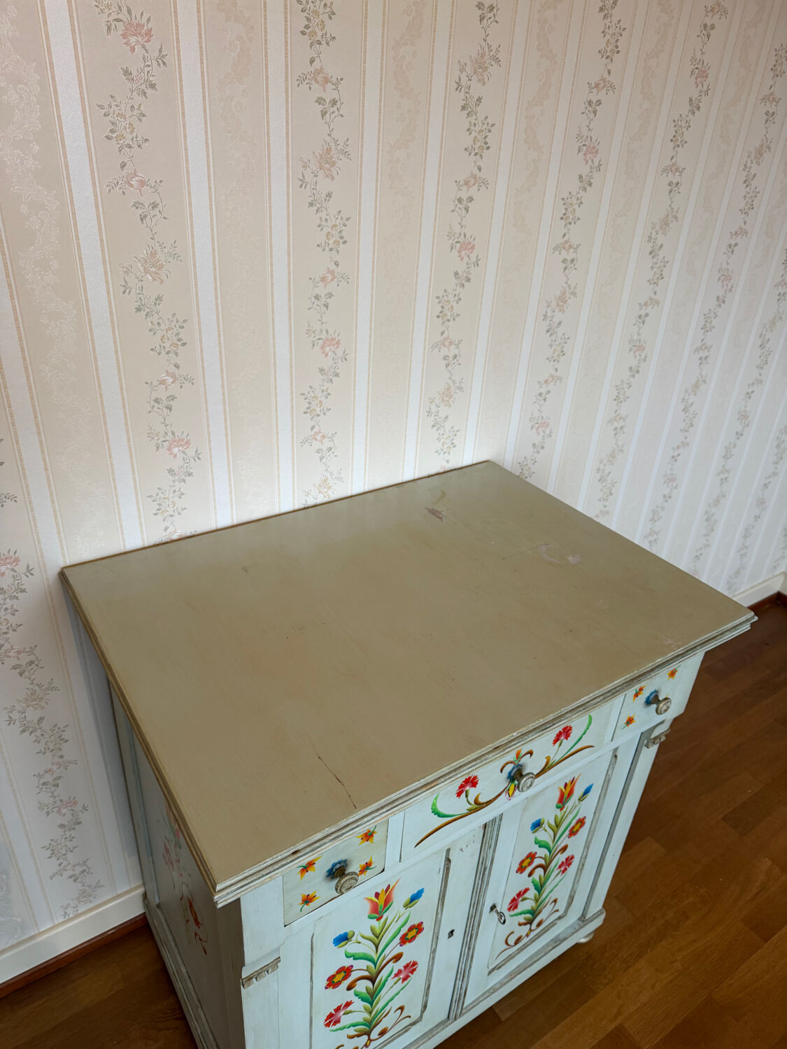 Antique low polychrome sideboard with floral decoration.
