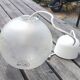 Frosted glass suspension globe with floral patterns in Art Deco style.